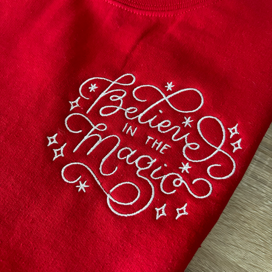 BELIEVE IN THE MAGIC Red Embroidered Christmas Crewneck Sweatshirt