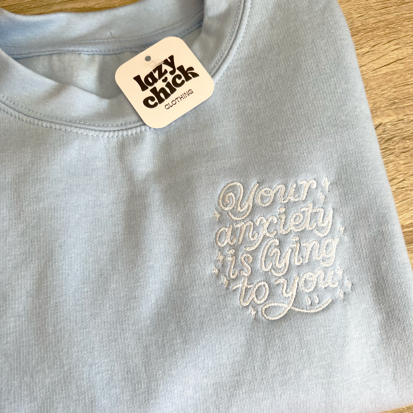 YOUR ANXIETY IS LYING TO YOU - Baby Blue Crewneck Sweatshirt